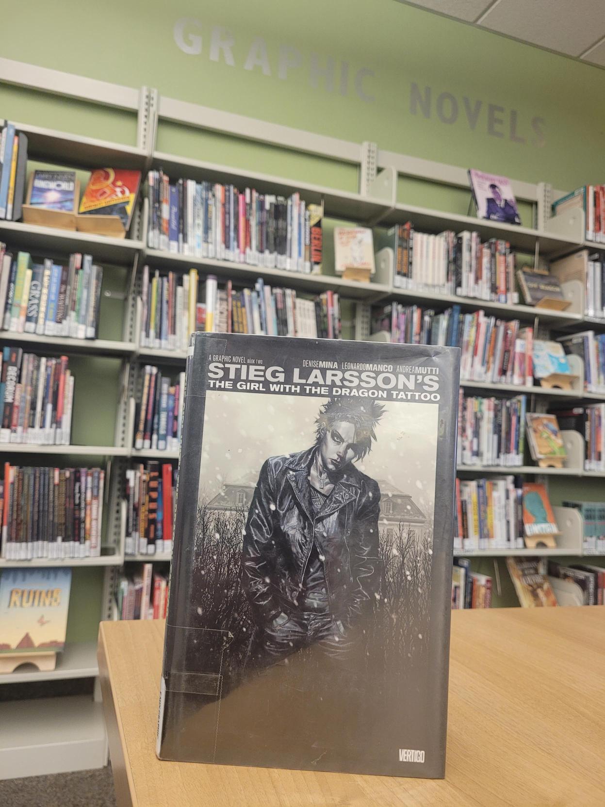 Image of graphic novel in front of Graphic Novel section