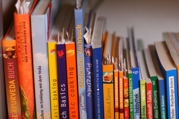 Image of several cookbooks on a shelf