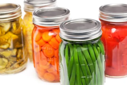 photo of canned green beans, carrots, and pickles