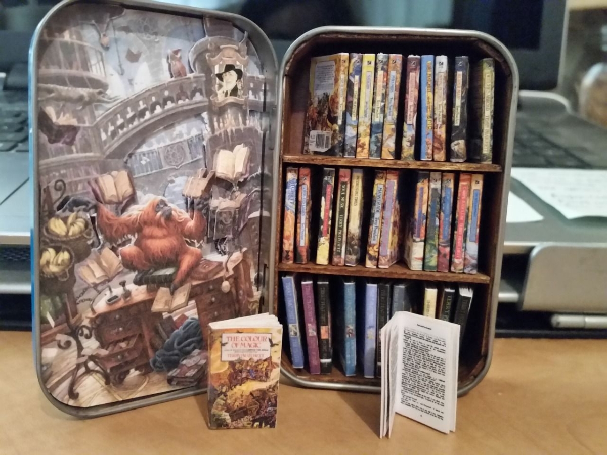 Image of tiny library in a mint tin from Pinterest